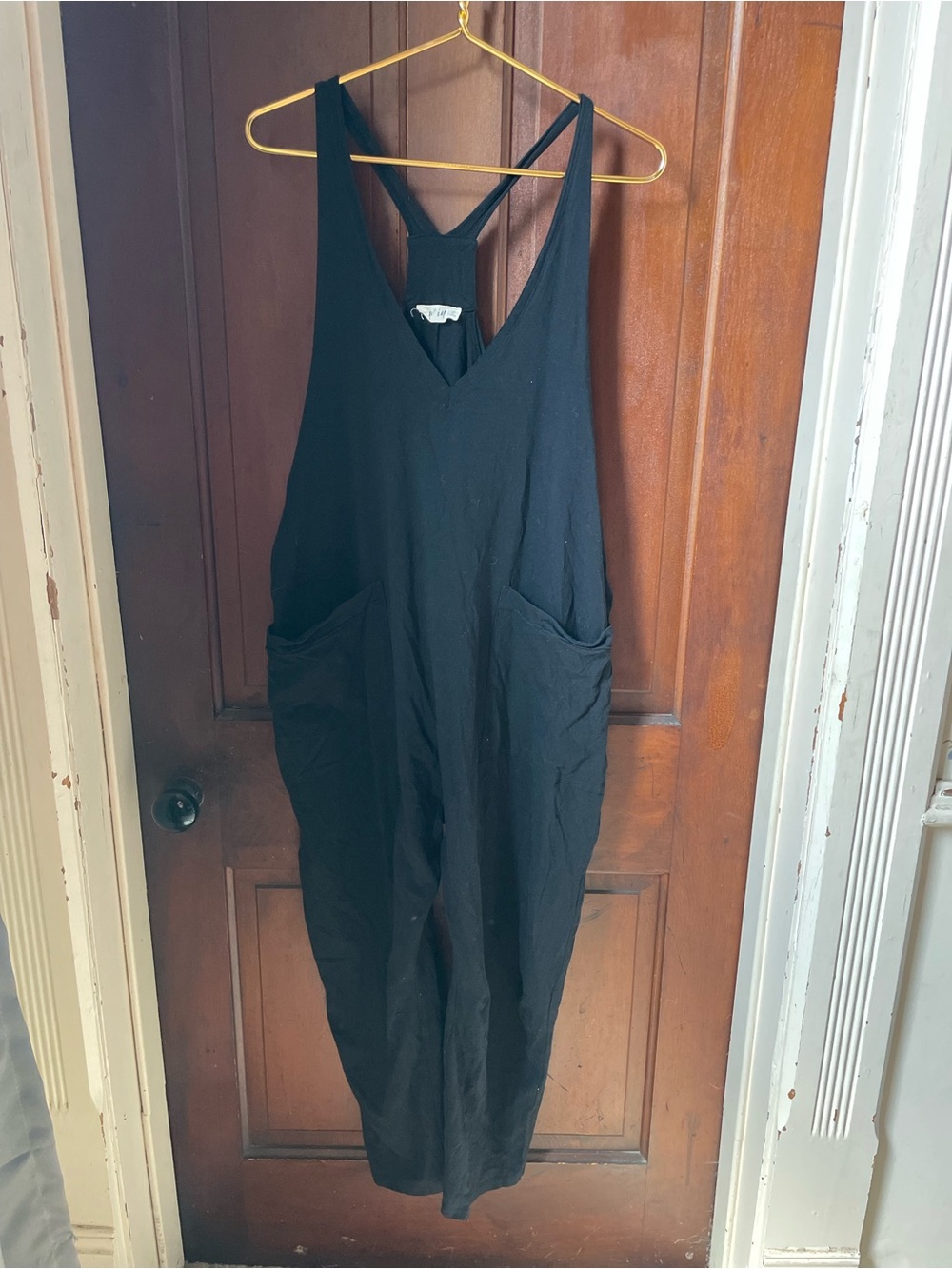 New In women's medium sleeveless black jumpsuit